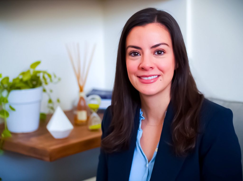 Photo of Dr. Yaima Alonso-Jeckell of Clinical Mind Psychiatry sitting in her Boca Raton, Fl office.